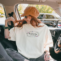 a woman sitting in the passenger seat of a car