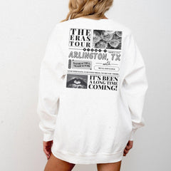 a woman is wearing a white sweatshirt with a picture of a woman's face
