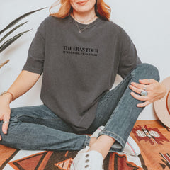 a woman sitting on the floor with her legs crossed