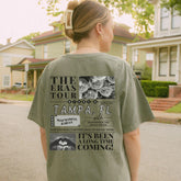 a woman standing on a street with a skateboard