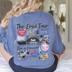 a woman sitting on top of a bed wearing a blue shirt