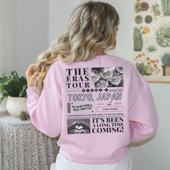 a woman wearing a pink sweatshirt and white pants