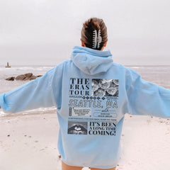 a person standing on a beach with their back to the camera