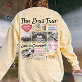 a woman wearing a yellow sweatshirt with the words the eras tour on it