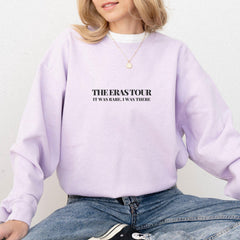 a woman wearing a purple sweatshirt with the words, the erasour it's