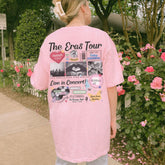 a woman in a pink shirt standing on a sidewalk