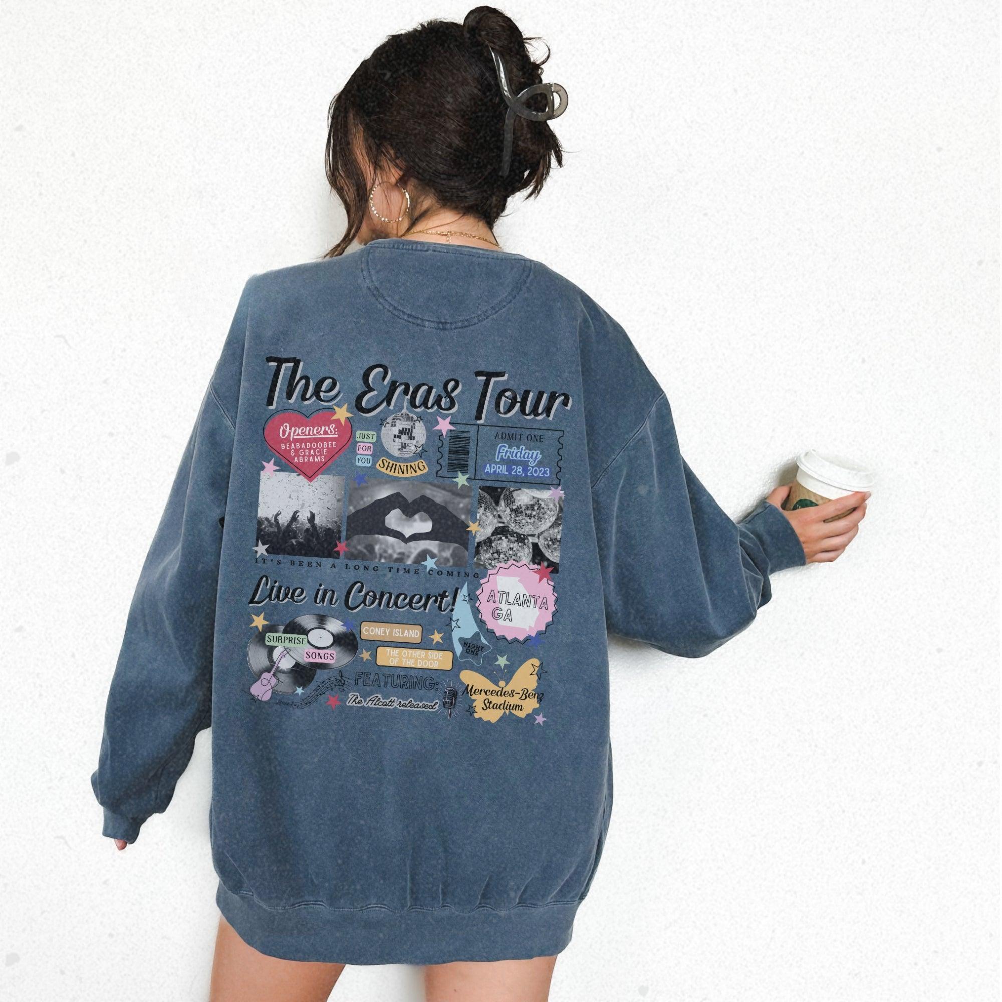 a woman in a blue jacket is holding a cup