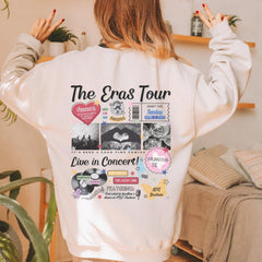 a woman wearing a white sweatshirt with the words the eras tour printed on it