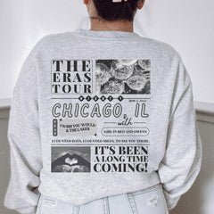 a woman wearing a sweatshirt with a chicago graphic on it