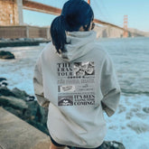a woman standing on a pier looking at the water