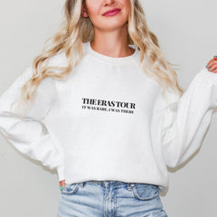 a woman with blonde hair wearing a white sweatshirt