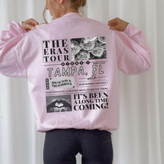 a woman wearing a pink jacket with pictures on it