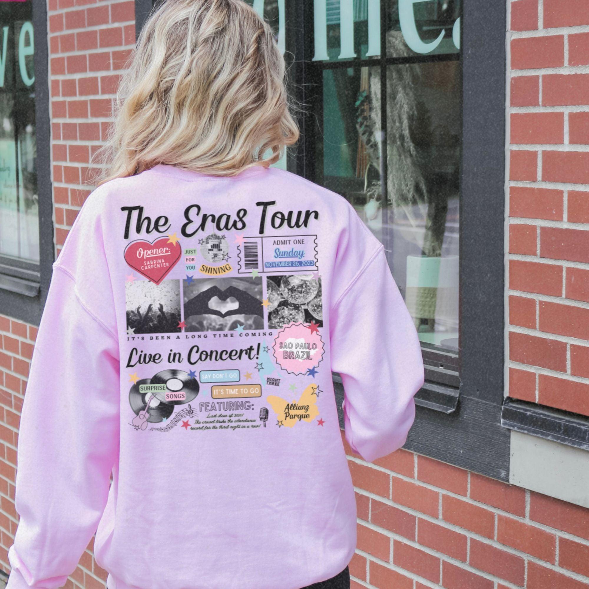 a woman in a pink shirt is standing in front of a building