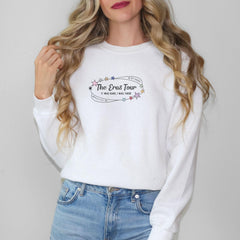 a woman wearing a white shirt and jeans