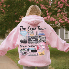 a girl in a pink hoodie with the words the eras tour on it