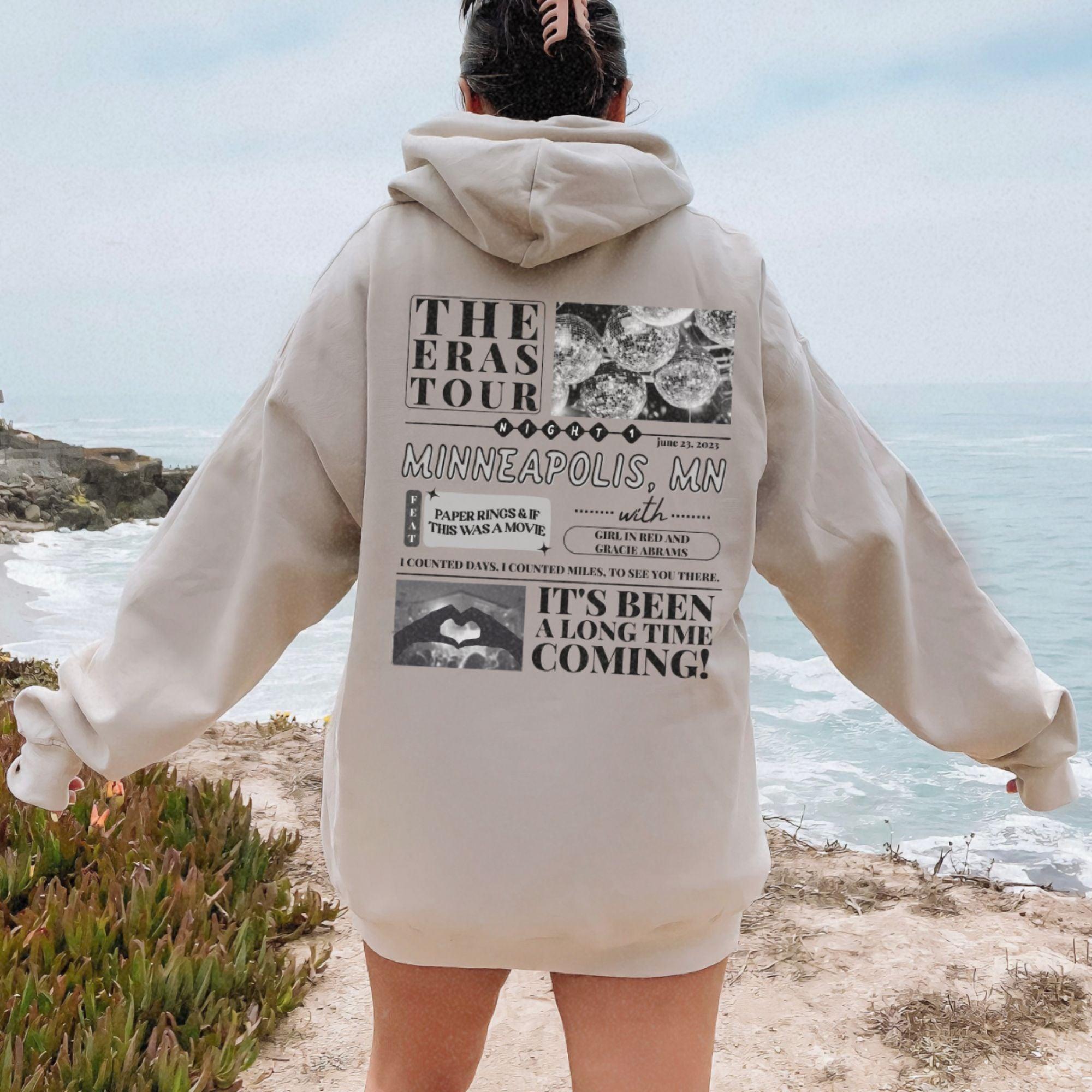 a person standing on a beach looking at the ocean