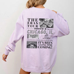 a woman wearing a purple sweatshirt dress with the words chicago printed on it