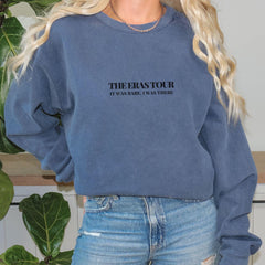 a blonde woman wearing a blue sweatshirt with the words the restour on it