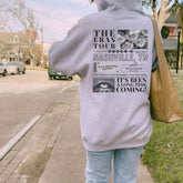 a person walking down a sidewalk with a bag on their back