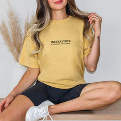 a woman sitting on a table with her legs crossed