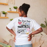 a woman standing in front of a couch with her back turned