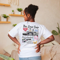 a woman standing in front of a couch with her back turned