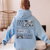 a person wearing a blue hoodie with a bunch of things on it