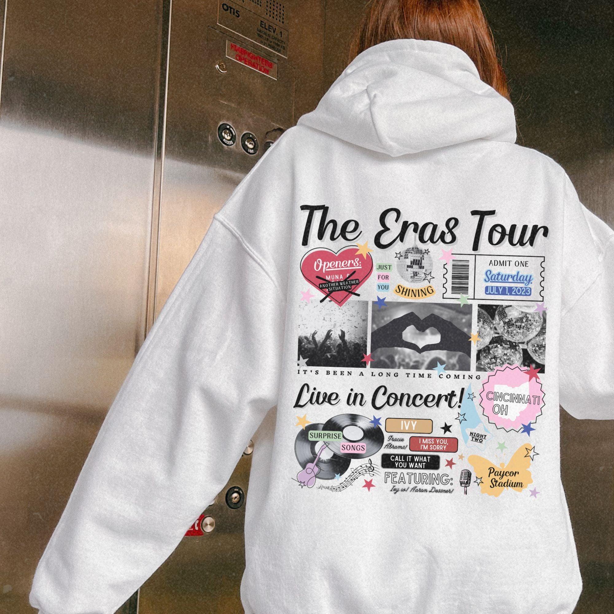 a woman wearing a white hoodie with the words the sros tour on it