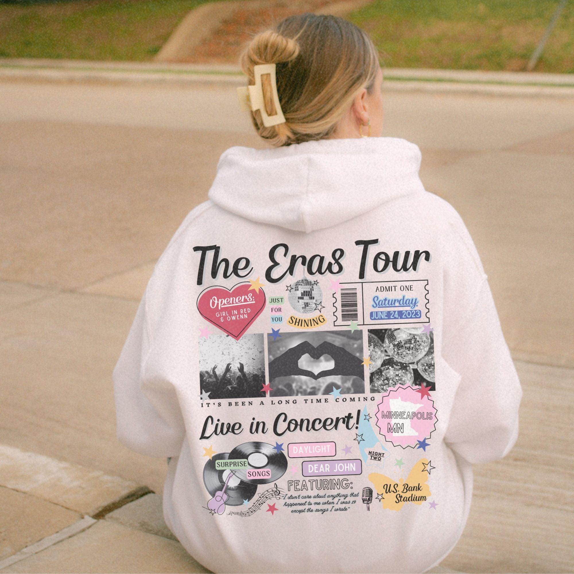 a person sitting on a curb with a hoodie on