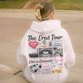 a person sitting on a curb with a hoodie on