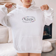a woman wearing a white hoodie with the words the end four printed on it