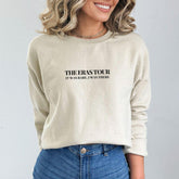 a woman wearing a sweatshirt with the words, the overstorir, it was