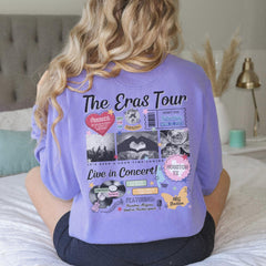 a woman sitting on a bed wearing a purple shirt