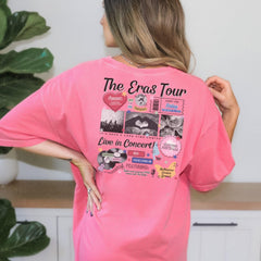 a woman wearing a pink shirt with pictures on it
