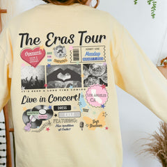 the back of a woman's yellow shirt with the words, the eras tour