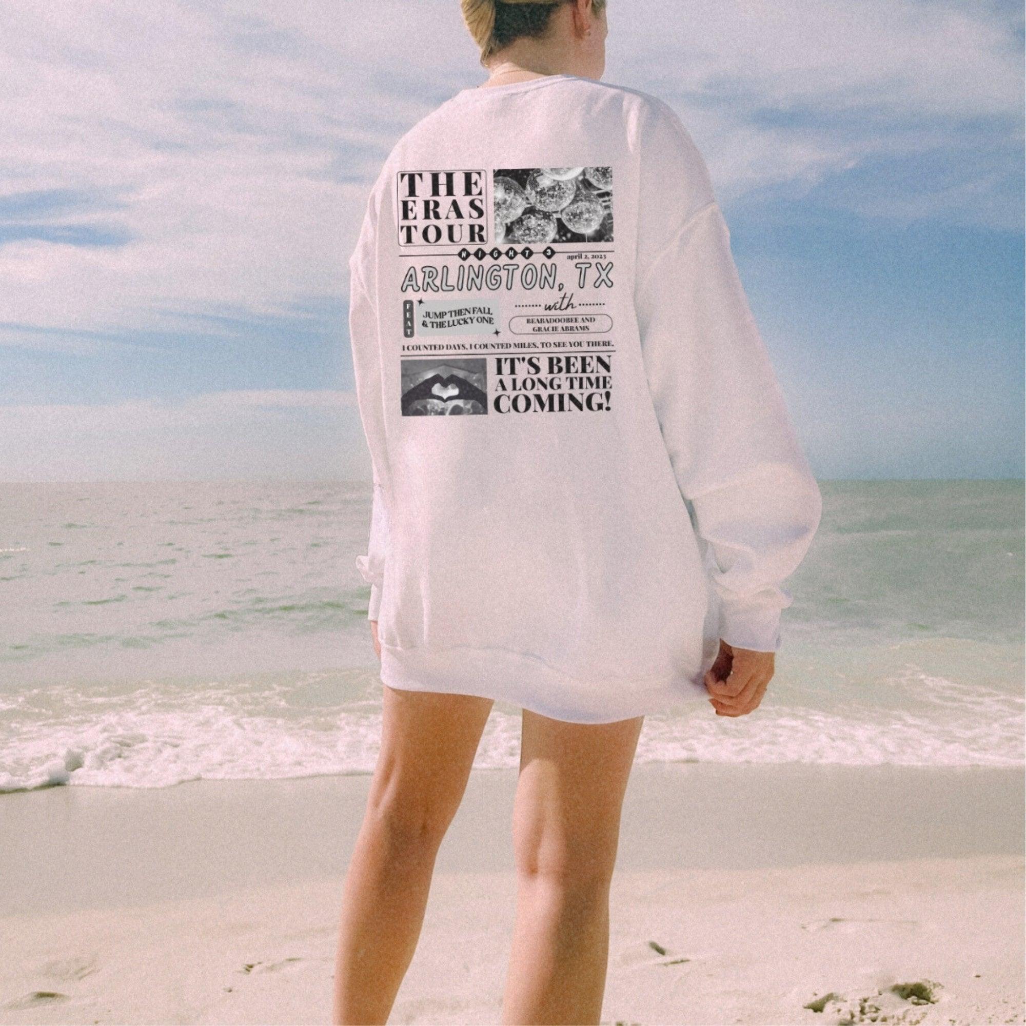 a person standing on a beach near the ocean