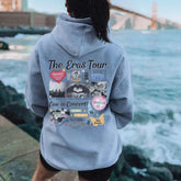 a woman standing on a pier looking at the water