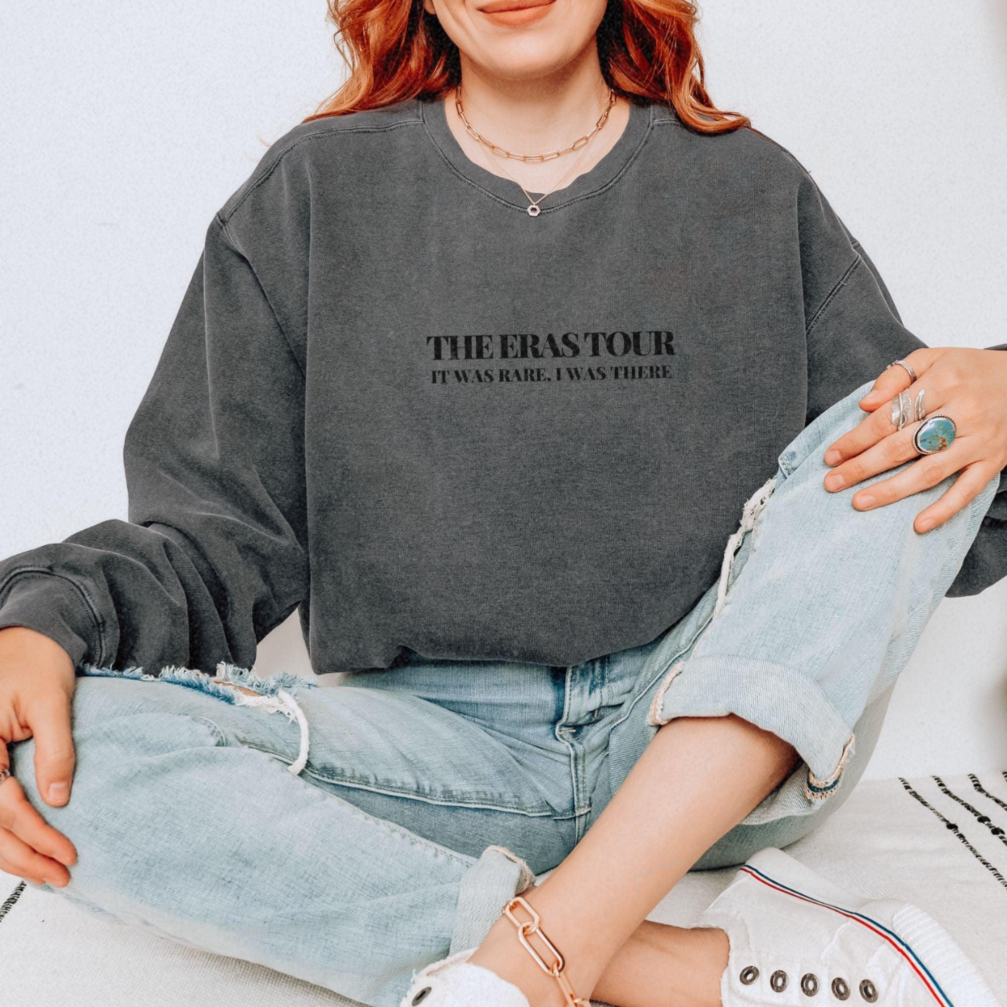 a woman sitting on the floor with her legs crossed