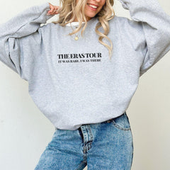 a woman wearing a grey sweatshirt with the words the seastour on it