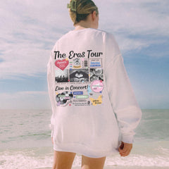 a woman is standing on the beach with her back to the camera