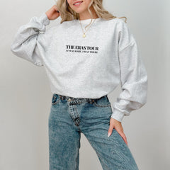 a woman wearing a grey sweatshirt with the words the bookstore on it
