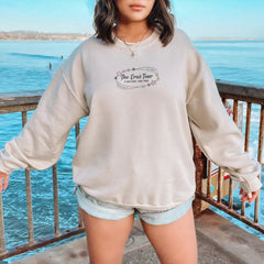 a woman standing on a balcony next to a body of water