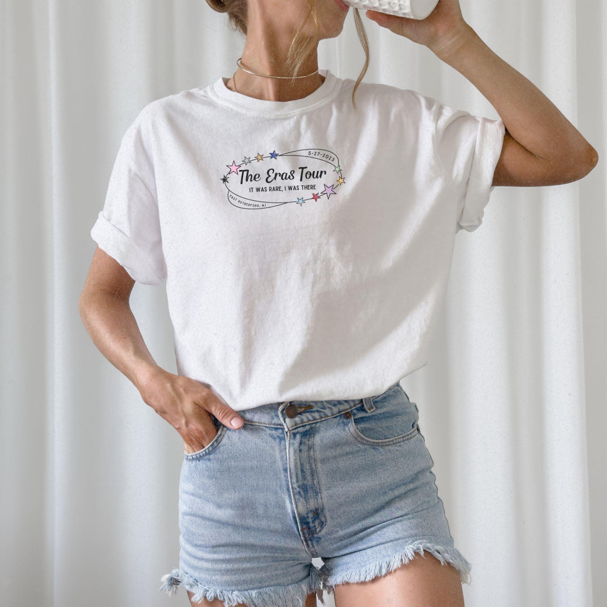 a woman in a white shirt drinking from a bottle