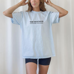 a woman wearing a t - shirt with the words the innotah on it