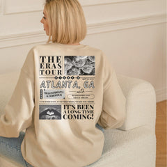 a woman sitting on a couch with her back to the camera