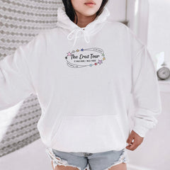 a woman wearing a white hoodie with the words the great tour on it