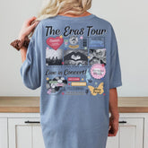 a woman standing in front of a counter wearing a blue shirt