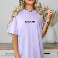 a woman wearing a lavender shirt with the words, there is a story on it