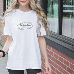 a woman in a white shirt is walking down the street