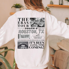 a woman wearing a white sweatshirt with the words houston, tx printed on it